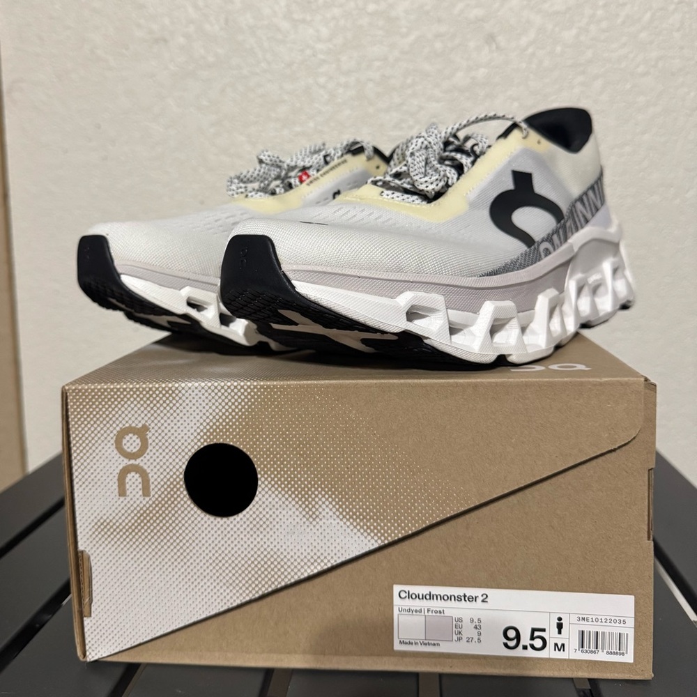 On Running White and Black Sneakers with Cloud Cushioning